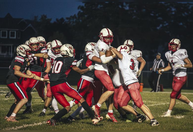 No. 2 Cardinal, Reid Hungerholt, is taken down by no. 1 Falcon, Jonas Dunn.  Photos by Sophie Horgan | Editor