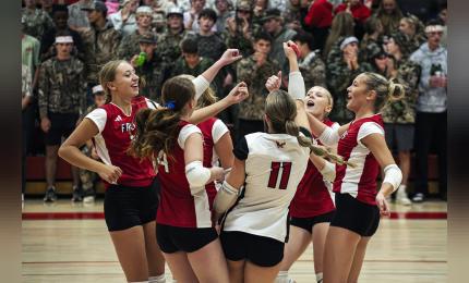 Falcons celebrate an ace serve by junior Kylee Metcalf.   Photos by Sophie Horgan | Editor